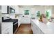 Modern kitchen with white cabinets, stainless steel appliances, and an island at 1373 6Th Ne St, Hickory, NC 28601