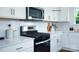 Modern kitchen features stainless steel appliances and white cabinetry at 1373 6Th Ne St, Hickory, NC 28601