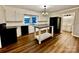 Modern kitchen featuring white cabinets, a kitchen island and black appliances at 2241 W Chester School Rd, Chester, SC 29706