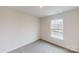 Simple bedroom with a window and neutral carpeting at 5063 Beargrass Dr, Dallas, NC 28034