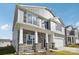 Two-story house with gray siding, stone accents, and a two-car garage at 7894 Old Brook Rd, Sherrills Ford, NC 28673