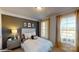 Cozy bedroom with a polka dot headboard and large window at 8020 Plymouth Dr, Sherrills Ford, NC 28673