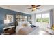 Spacious bedroom with large windows, mirrored headboard, and neutral decor at 8020 Plymouth Dr, Sherrills Ford, NC 28673