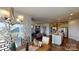Open dining area with access to a private balcony and living room view at 8020 Plymouth Dr, Sherrills Ford, NC 28673