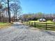 Gravel driveway leading to the house, barn, and greenhouse at 1101 Running Brook Rd, Midland, NC 28107