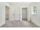 Bedroom with double-door closet and access to the hall at 1210 Green Oaks Ln # G, Charlotte, NC 28205