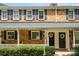 Brick townhouse with a porch and landscaping at 1210 Green Oaks Ln # G, Charlotte, NC 28205