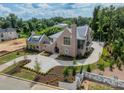 Luxury home with brick exterior, large driveway, and landscaped yard at 8010 Litaker Manor Ct, Charlotte, NC 28270