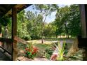 Porch view of landscaped yard and driveway entrance at 6255 Meadow Ln, Salisbury, NC 28147