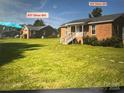 Two brick houses side-by-side with yards and ample parking at 835 & 837 Sikes Mill Rd, Monroe, NC 28110