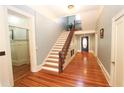 Elegant entryway with hardwood floors and staircase at 318 Camden Rd, Wadesboro, NC 28170
