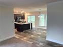 Modern kitchen with island and stainless steel appliances at 5716 Dalmatian St, Iron Station, NC 28080