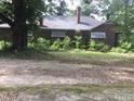 Brick house with awnings and overgrown landscaping at 510 & 516 & 520 N Matson N Matson St, Kershaw, SC 29067