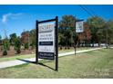 Community sign announcing new luxury residences at 5704 Heirloom Crossing Ct, Charlotte, NC 28270