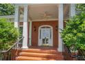 The front entrance features a brick staircase and a covered porch with columns at 620 N 9Th St # 5/6, Albemarle, NC 28001