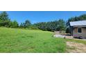 Large grassy yard with a partially visible house at 1672 Riverview Rd, Lincolnton, NC 28092
