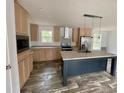 Spacious kitchen featuring granite countertops and a large island at 5433 King Wilkinson Rd, Denver, NC 28037