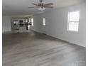 Open living room with kitchen and gray flooring at 321 Linestowe Dr, Belmont, NC 28012