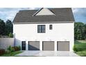 Three-car garage with gray doors and extra storage at 1518 Billy Howey Rd # 6, Waxhaw, NC 28173