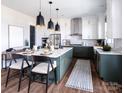 Modern kitchen with green cabinets, white countertops, and a large island at 841 Lake Forest Dr # Hawthorne, Belmont, NC 28012