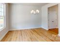 Bright dining room with hardwood floors and chandelier at 230 Hamrick Rd # 2, Cramerton, NC 28032