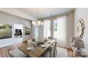 Virtually staged dining room with wood table and chairs at 230 Hamrick Rd # 2, Cramerton, NC 28032