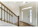 Bright entryway with staircase and wood railing at 8631 Frank Grier Rd # 6, Charlotte, NC 28215