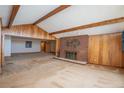 Spacious living room with brick fireplace and wood paneling at 3616 County Home Rd, Conover, NC 28613