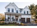 Two-story farmhouse with white siding, brown accents, and a large front porch at 833 Lake Forest Dr # Covington, Belmont, NC 28012