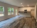 Open kitchen with island and stainless steel appliances at 305 Firefly Path, Shelby, NC 28150