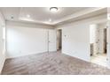 Spacious bedroom with carpeted floor and access to bathroom at 2786 Yeager Nw Dr, Concord, NC 28027