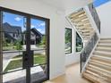 Modern entryway with glass doors and a view of the street at 934 Laurel Creek Ln, Charlotte, NC 28211