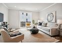 Bright living room with comfy seating and large art piece at 1424 Hamilton St # 12, Charlotte, NC 28206