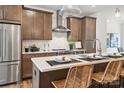 Modern kitchen with stainless steel appliances and an island at 1424 Hamilton St # 12, Charlotte, NC 28206