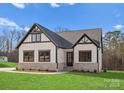 Craftsman style home with white siding, stone accents, and a welcoming front entrance at 179 Heartland Dr # 8, Rock Hill, SC 29732