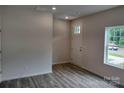Bright entryway with wood-look flooring and a white door at 4225 S New Hope Rd # 9, Cramerton, NC 28032