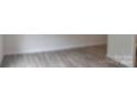 Empty bedroom with light gray walls and wood-look flooring at 4225 S New Hope Rd # 9, Cramerton, NC 28032