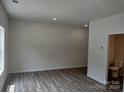 Spacious bedroom with wood-look flooring and ensuite bath at 4223 S New Hope Rd # 8, Cramerton, NC 28032