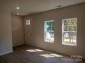 Bright entryway with hardwood floors and windows at 4229 S New Hope Rd # 11, Cramerton, NC 28032