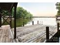 Spacious wooden dock offering lake access, perfect for relaxing and enjoying water activities at 165 Clearview Point Dr, Mount Gilead, NC 27306