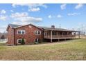 Brick ranch house with a large deck and spacious backyard at 1551 J Rhyne Reep Rd, Vale, NC 28168