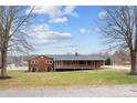 Brick ranch home with a long deck and expansive yard at 1551 J Rhyne Reep Rd, Vale, NC 28168