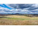 Farmland with rolling hills and cloudy sky at 200 Keever Ln, Hiddenite, NC 28636