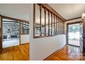 Bright living room with hardwood floors and a wood partition at 3811 Sherer Rd, Sharon, SC 29742