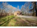 Brick detached garage with double doors and ample parking space at 1836 Westbrook Rd, Edgemoor, SC 29712