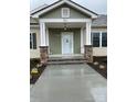 Front entrance with stone pillars and covered porch at 501 Chestnut Grove Rd, Statesville, NC 28625