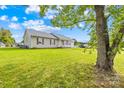Ranch style home with a large yard and mature tree at 215 Bethesda Rd, Statesville, NC 28677