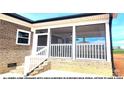 Screened porch with white railings and steps at 00 Wilson Ct # 15, Lincolnton, NC 28092