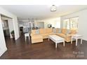 Spacious living room with hardwood floors, and L-shaped sectional sofa at 317 Gardner Point Dr, Stony Point, NC 28678