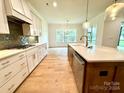 Open concept kitchen with stainless steel appliances and large island at 3860 Nc Hwy 200 Hwy, Concord, NC 28025